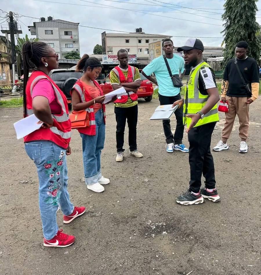 Briefing on the lot before road work. Everyone is in hi-vis before anyone goes near moving traffic.